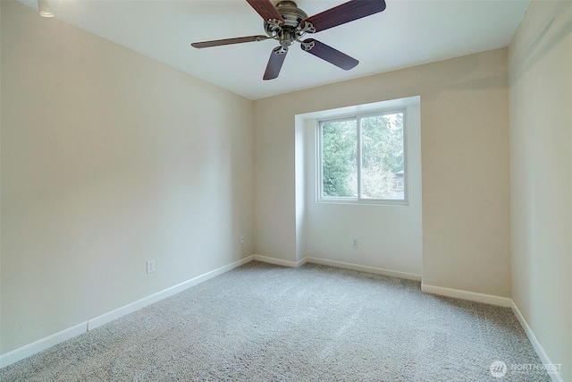 carpeted empty room with ceiling fan