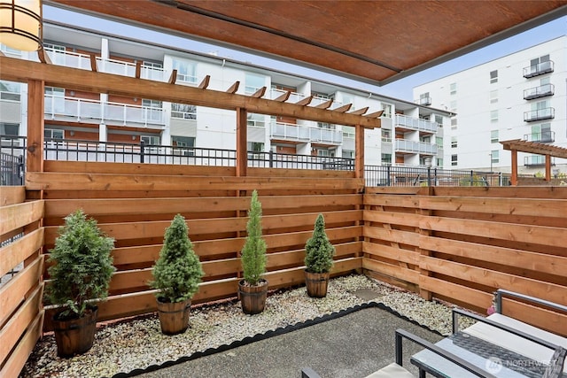 view of patio featuring fence