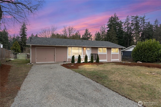 ranch-style home featuring a lawn