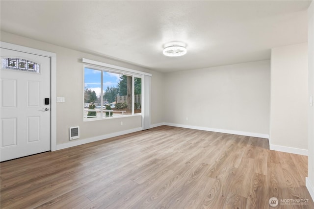 foyer with light hardwood / wood-style floors