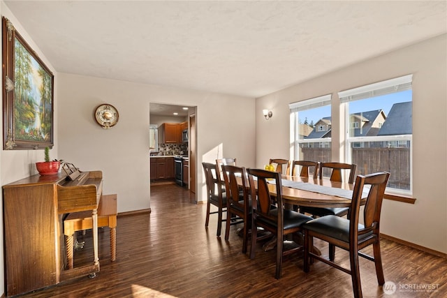 dining area with dark hardwood / wood-style flooring