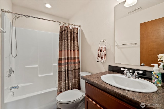 full bathroom with vanity, shower / bath combination with curtain, and toilet