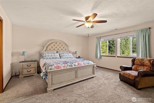 bedroom with light colored carpet and ceiling fan