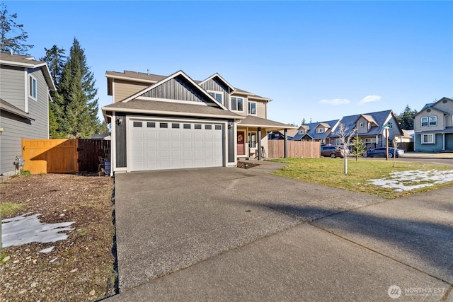 view of front of house with a garage and a front lawn