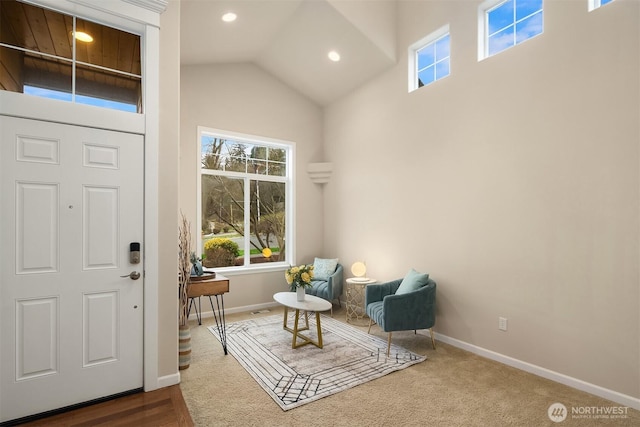 living area with high vaulted ceiling