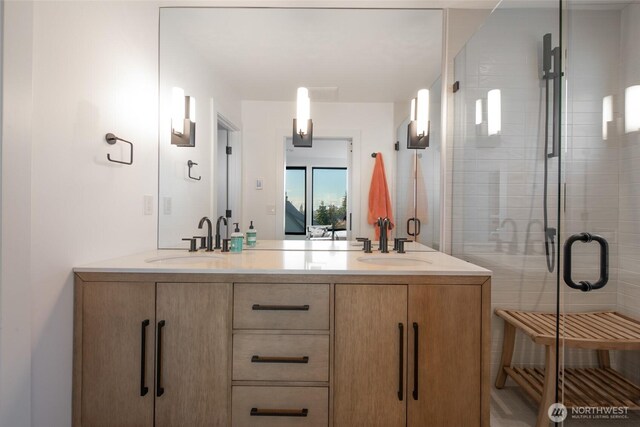 bathroom with vanity and walk in shower