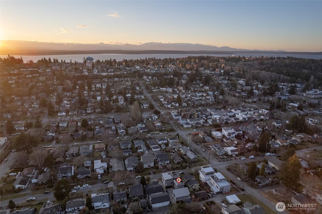 aerial view at dusk with a water view