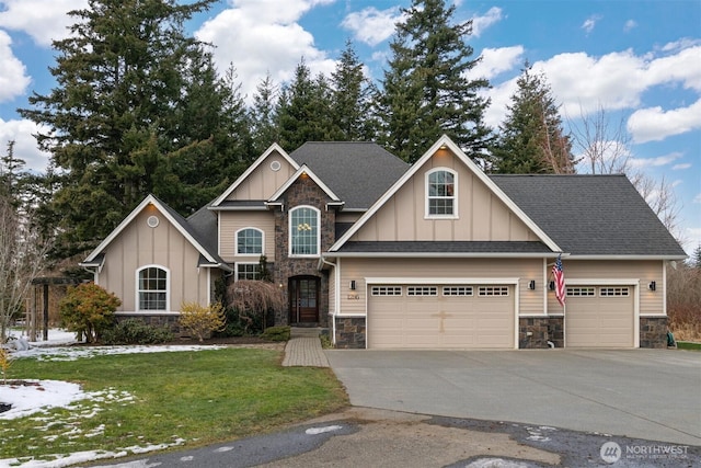 view of front of home featuring a garage and a front lawn