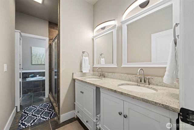 bathroom featuring vanity and a shower with shower door