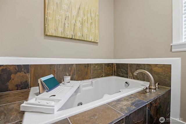 bathroom featuring a relaxing tiled tub