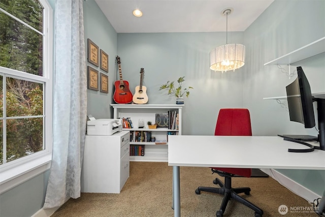 carpeted home office with plenty of natural light