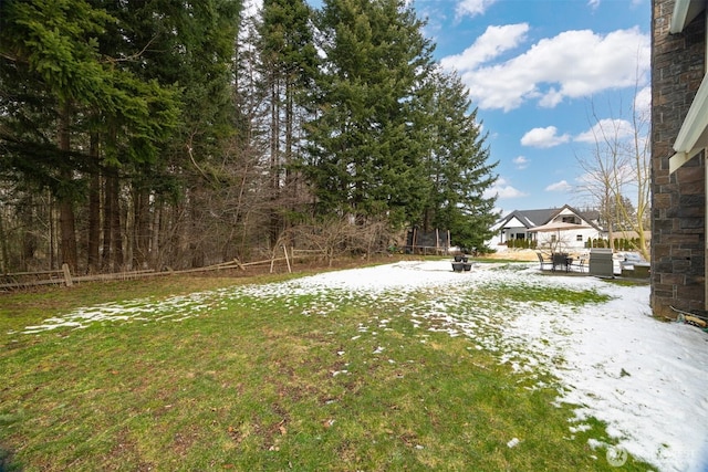 view of yard layered in snow