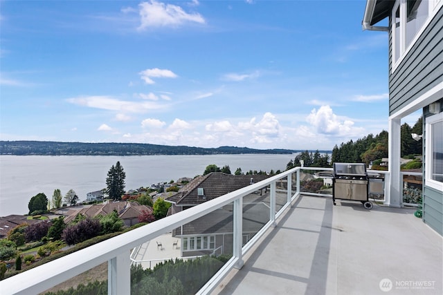 balcony featuring a water view