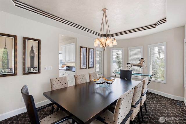 dining space featuring a notable chandelier