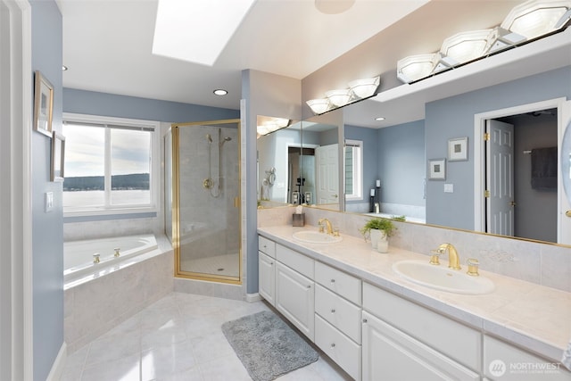 bathroom with vanity, separate shower and tub, tile patterned floors, and a skylight