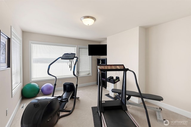 workout room with light colored carpet