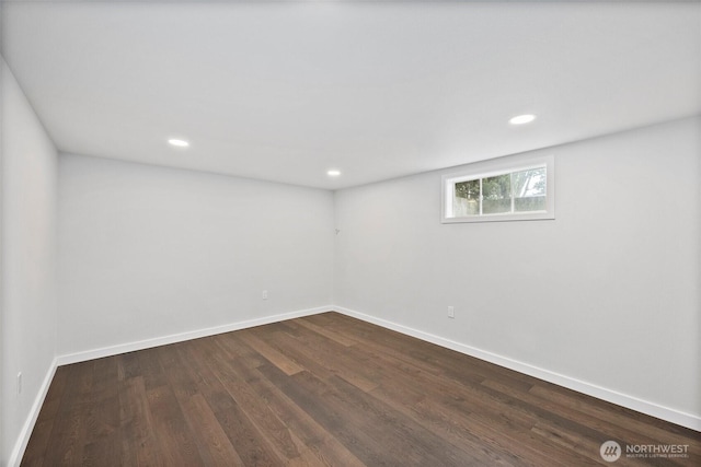 spare room with dark wood-type flooring