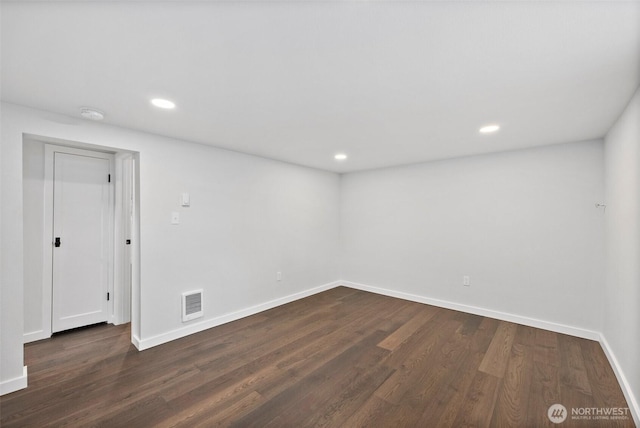 empty room featuring dark hardwood / wood-style floors