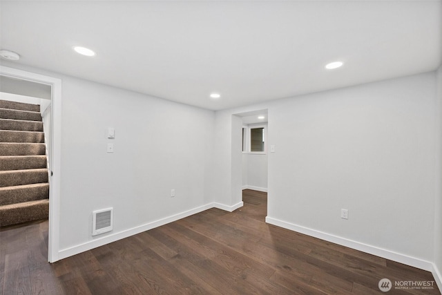 unfurnished room with dark hardwood / wood-style floors