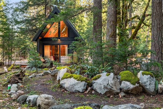 view of outbuilding featuring a wooded view