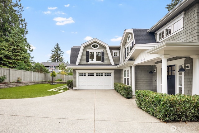 view of home's exterior with a yard and a garage