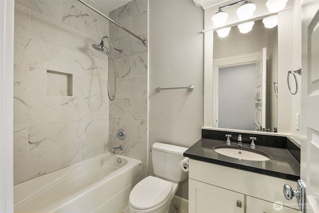 full bathroom featuring vanity, toilet, and tiled shower / bath