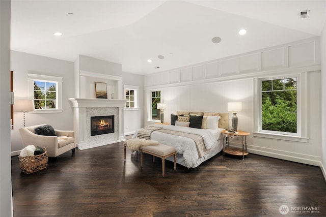 bedroom featuring dark hardwood / wood-style floors and high vaulted ceiling