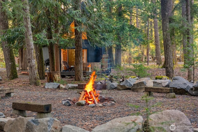 view of yard with a fire pit