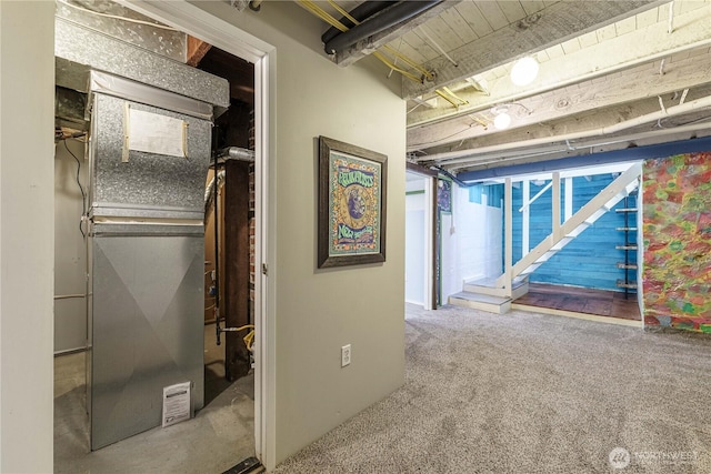 interior space featuring carpet flooring and heating unit