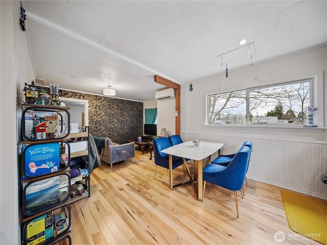 interior space featuring wood-type flooring and a wall unit AC