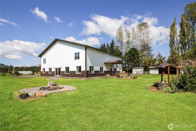 314 E Valley Rd, Skamokawa, WA 98647 - rear view of property featuring an outdoor fire pit and a yard