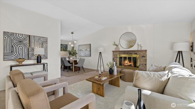 carpeted living room featuring lofted ceiling and a fireplace