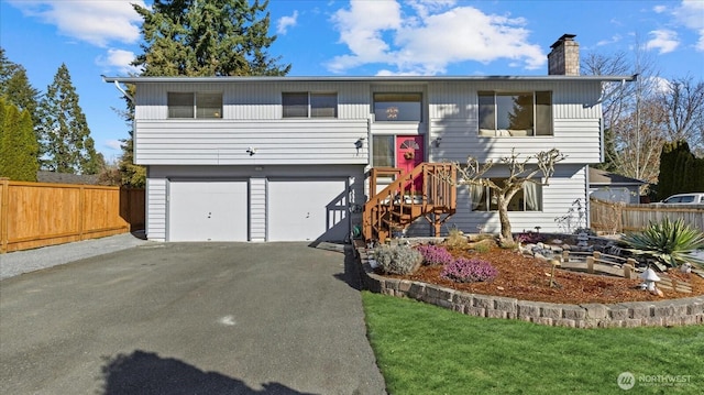 bi-level home featuring a garage