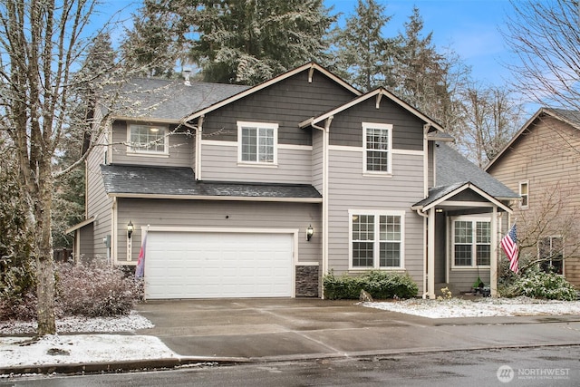 view of front of property with a garage