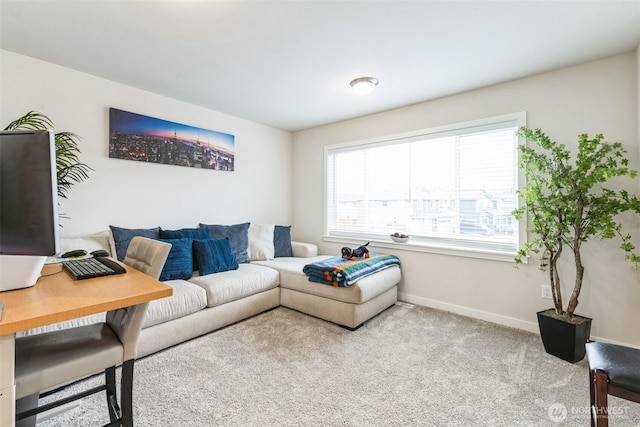 living room featuring light colored carpet and baseboards