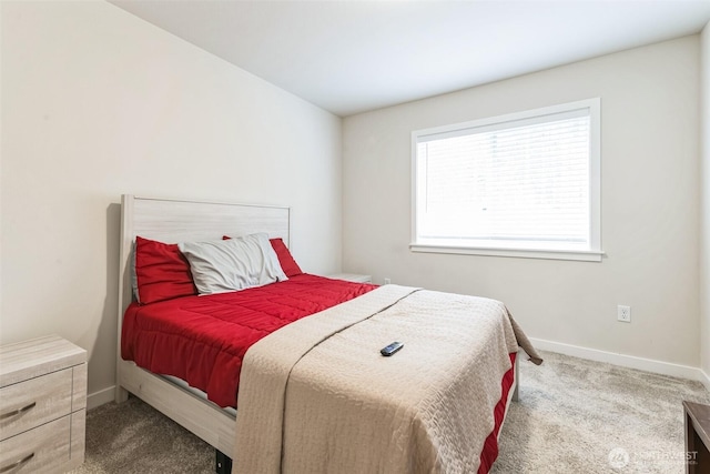 carpeted bedroom featuring baseboards