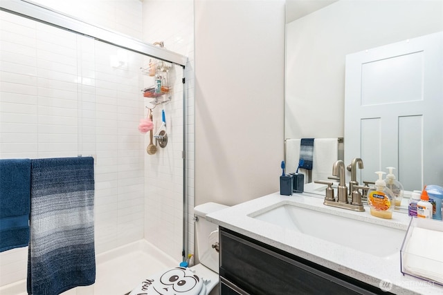 full bathroom featuring a stall shower and vanity