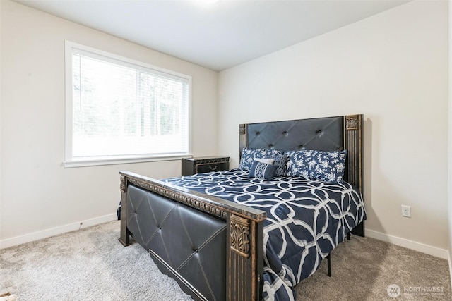 carpeted bedroom with baseboards