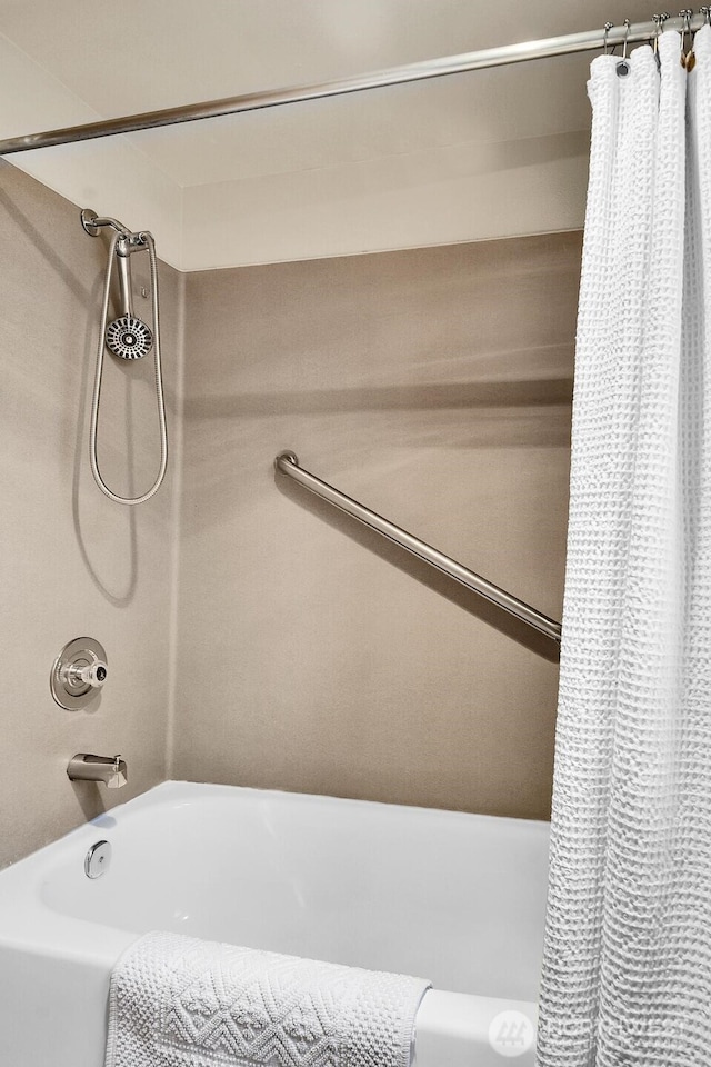 bathroom featuring shower / bathtub combination with curtain