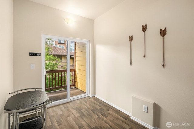 doorway to outside featuring wood-type flooring