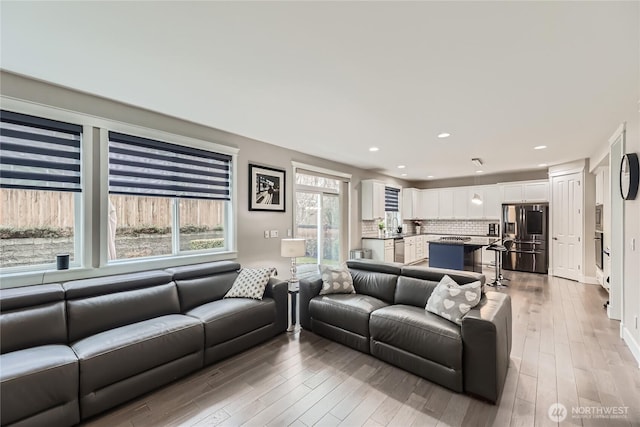 living room featuring wood finished floors and recessed lighting