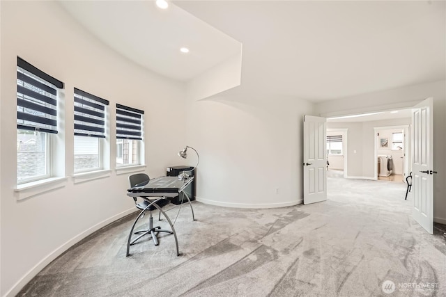 miscellaneous room featuring a wealth of natural light, light carpet, baseboards, and recessed lighting