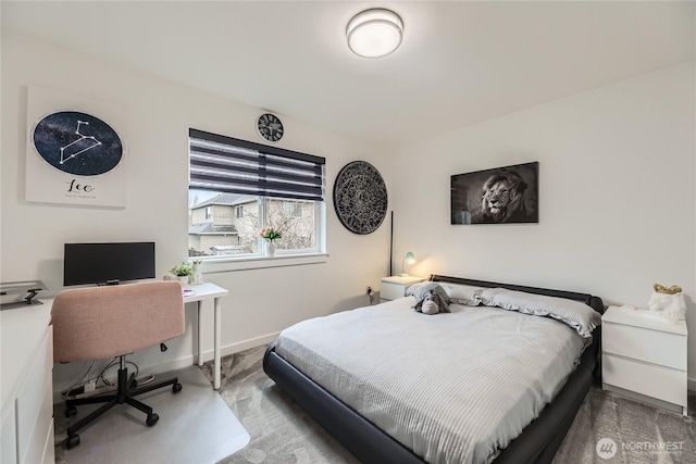 bedroom featuring baseboards and carpet flooring