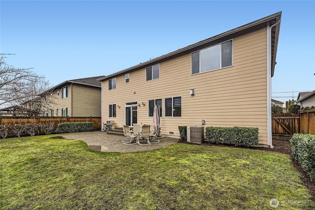 back of house featuring a patio area, a lawn, a fenced backyard, and central AC unit