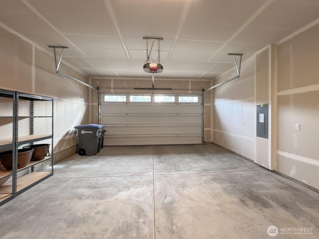 garage featuring a garage door opener and electric panel