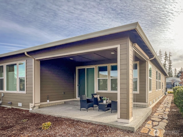 back of house featuring crawl space and a patio area