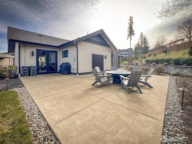 view of patio / terrace featuring french doors and fence