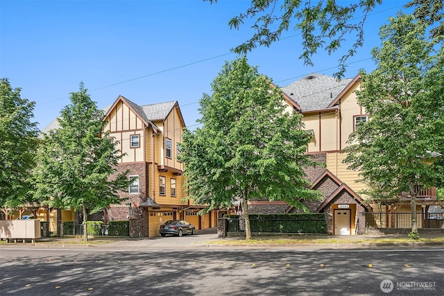 tudor-style house with a garage