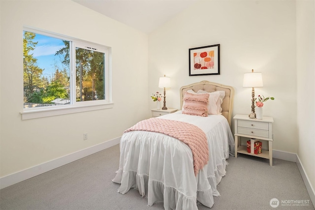 carpeted bedroom featuring vaulted ceiling