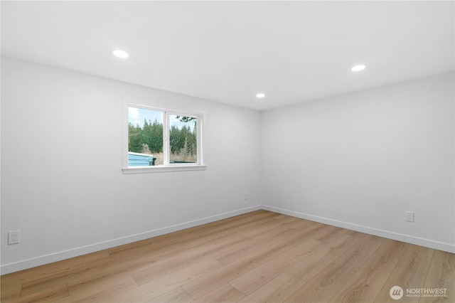 unfurnished room featuring light hardwood / wood-style flooring